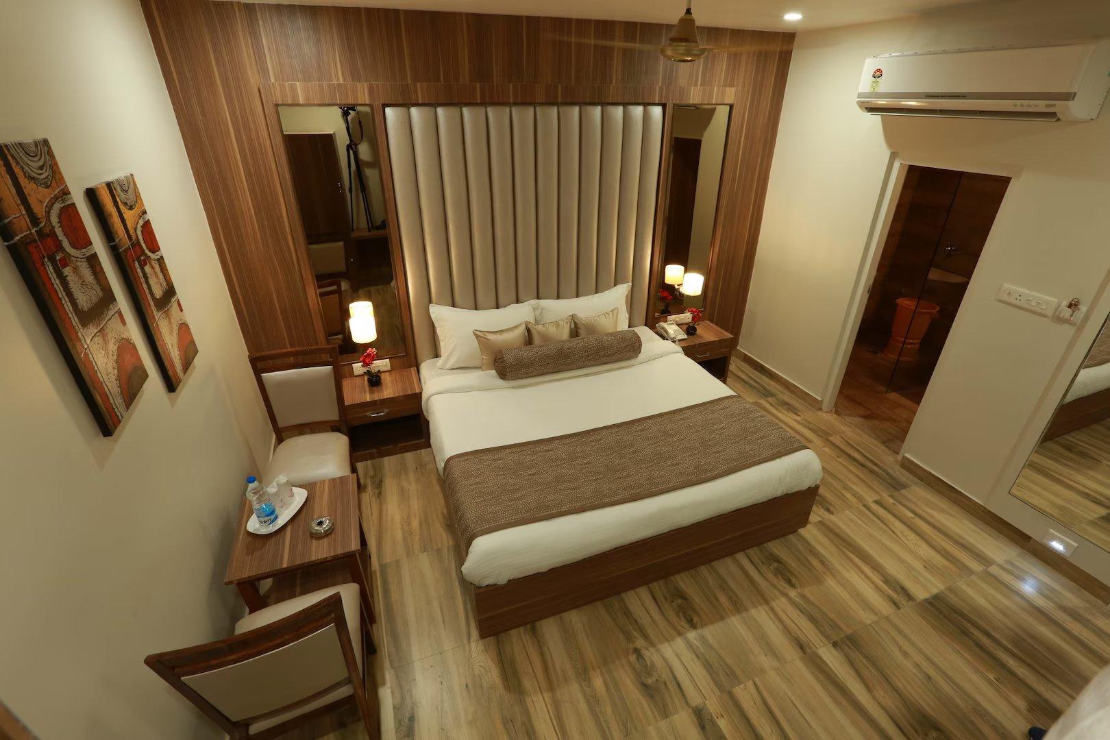 a double bed room with t.v at at royal palace in ajmer