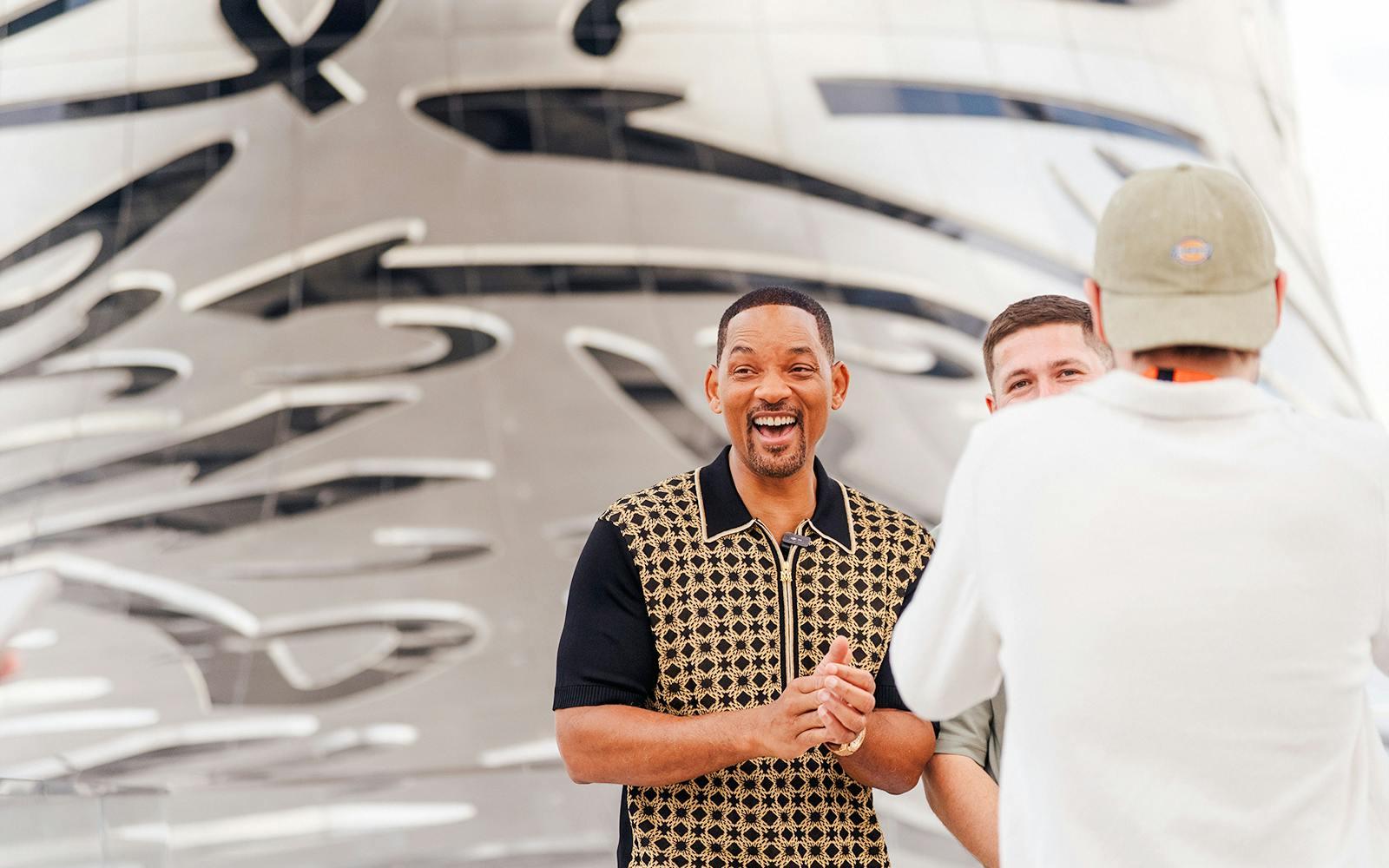 Visitors outside the Museum of the Future in Dubai, featuring its iconic architectural design. Visitors outside the Museum of the Future in Dubai, featuring its iconic architectural design.